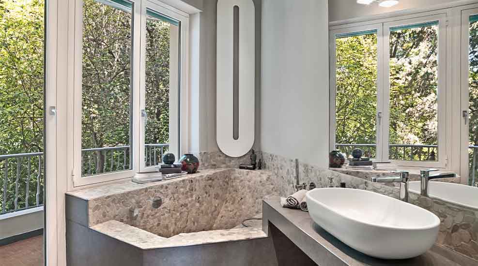 Luxury bathroom remodel with stone bathtub and modern sink installed by L.F. Fenimore Plumbing and HVAC in South New Jersey.