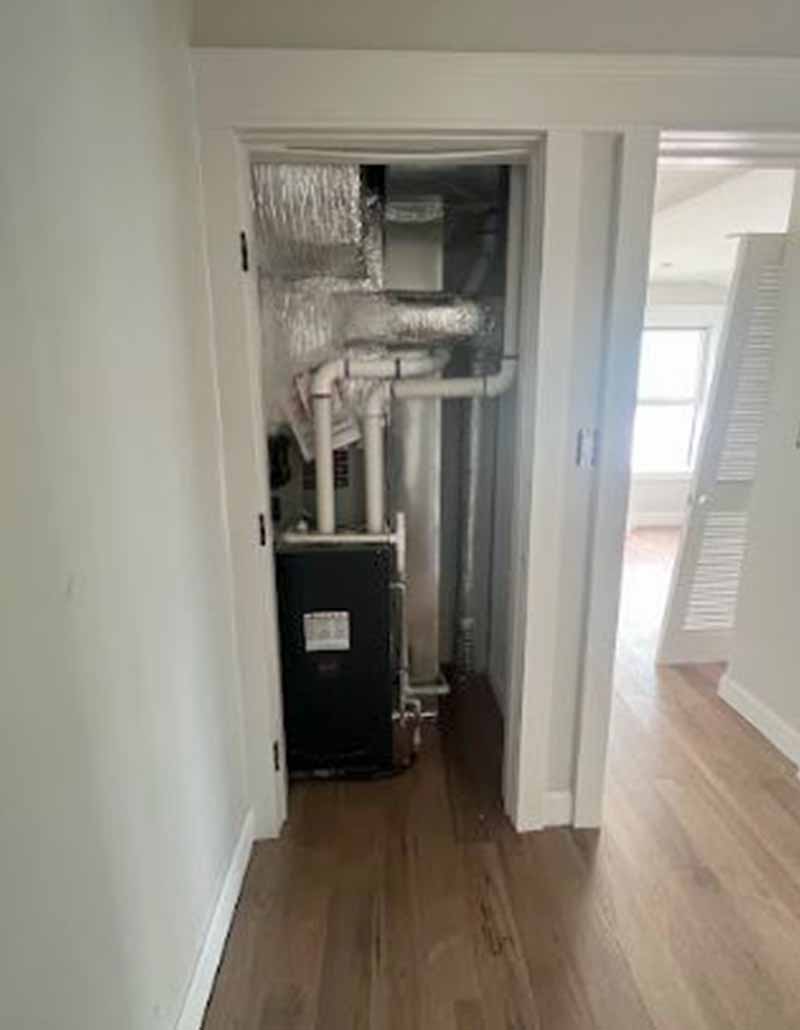 Residential HVAC system installation inside utility closet by L.F. Fenimore Plumbing and HVAC in South Jersey.